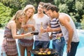 Group of happy friends looking at mobile phone Royalty Free Stock Photo