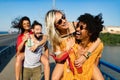 Group of happy friends people having fun together outdoors Royalty Free Stock Photo