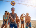 Group of friends playing at beach volley at the beach Royalty Free Stock Photo