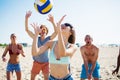 Group of friends playing at beach volley at the beach Royalty Free Stock Photo