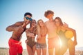 Group of friends playing at beach volley at the beach Royalty Free Stock Photo