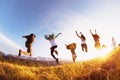 Group happy friends runs and jumps mountains sunset Royalty Free Stock Photo