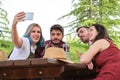 Group of happy friends taking a selfie and having fun in a park Royalty Free Stock Photo