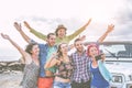 Group of happy friends taking a selfie using mobile smart phone during a road trip with jeep car - Travel people having fun Royalty Free Stock Photo