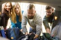 Group of happy friends taking their bags from a car to start a hike . Royalty Free Stock Photo