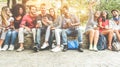 Group of happy friends using smartphones for taking photos and watching videos - Teenagers having fun outdoor with technology Royalty Free Stock Photo