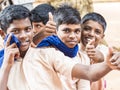 Group of happy funny children friends boys classmates smiling laughing showing thumb up gesture at the school Royalty Free Stock Photo