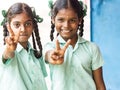 Group of happy funny children friends classmates smiling doing victory peace sign gesture with fingers at the school. School kids Royalty Free Stock Photo