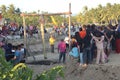 group of happy Indonesian children with full of mud is playing Indonesia traditional games