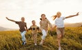 Group of happy joyful school kids boys and girls running with holding hands in field on sunny day Royalty Free Stock Photo