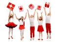 Group of happy kids in Christmas hat catching gift