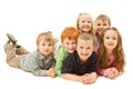 Group of happy kids laying on floor together Royalty Free Stock Photo