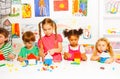 Group of happy kids play with plastic blocks Royalty Free Stock Photo