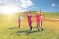 Group of happy kids running outdoors