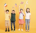 Group of happy kids showing the flags