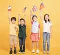 Group of happy kids showing the flags