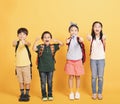 Group of happy kids showing the thumbs up