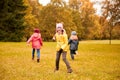 Group of happy little kids running outdoors Royalty Free Stock Photo