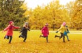 Group of happy little kids running outdoors Royalty Free Stock Photo