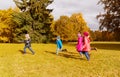 Group of happy little kids running outdoors Royalty Free Stock Photo