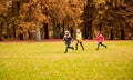 Group of happy little kids running outdoors Royalty Free Stock Photo