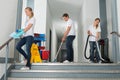 Janitors Cleaning Corridor With Cleaning Equipments Royalty Free Stock Photo