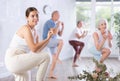 Group of happy mature sports women and man in activewear exercising dynamic dancing movemens in gym studio Royalty Free Stock Photo