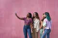 group of multiethnic girls taking a selfie with smartphone Royalty Free Stock Photo