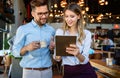 Group of happy multiethnic successful business people having fun, work and meeting in cafe. Royalty Free Stock Photo