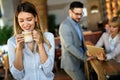 Group of happy multiethnic successful business people having fun, work and meeting in cafe. Royalty Free Stock Photo