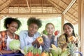 Group of happy Multiethnic teenager friend holding organic food products from their own farm at local market fair, smiling young Royalty Free Stock Photo