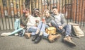 Group of happy multiracial best friends having fun using mobile phone Royalty Free Stock Photo