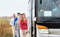 Group of happy passengers boarding travel bus Royalty Free Stock Photo