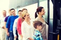 Group of happy passengers boarding travel bus Royalty Free Stock Photo