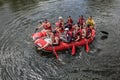 Group of happy people with guide whitewater rafting and rowing on river,  extreme and fun sport Royalty Free Stock Photo