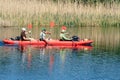 Ukraine, the city of Romny, May 22, 2021: A group of happy people are kayaking on the river. Concept of World Tourism Day. Active 