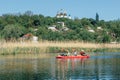 Ukraine, the city of Romny, May 22, 2021: A group of happy people are kayaking on the river. Concept of World Tourism Day. Active