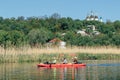 Ukraine, the city of Romny, May 22, 2021: A group of happy people are kayaking on the river. Concept of World Tourism Day. Active