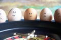 Group of happy and sad eggs friends  make bets gambiling at the toy roulette in the toy casino Royalty Free Stock Photo