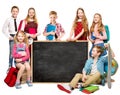 Group of Happy School Kids next to Blackboard. Children Learning and Back to School Concept. Elementary Education Students Royalty Free Stock Photo