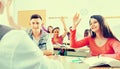 Group of happy school pupils raise their hands up Royalty Free Stock Photo