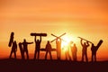 Group of happy silhouettes of skiers and snowboarders