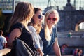 Group of happy smiling carefree young stylish girls communicate Royalty Free Stock Photo