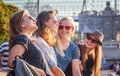 Group of happy smiling carefree young stylish girls communicate Royalty Free Stock Photo