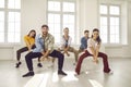 Group of happy, smiling young dancers rehearsing a new dance in their modern studio Royalty Free Stock Photo