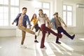 Group of happy smiling young professional dancers having fun in modern dance hall Royalty Free Stock Photo