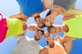 Group of happy sporty friends in circle outdoors Royalty Free Stock Photo