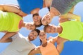 Group of happy sporty friends in circle outdoors Royalty Free Stock Photo