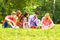 Group of happy students with books in the Park Royalty Free Stock Photo