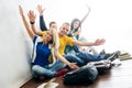 Group of happy students on a break waving Royalty Free Stock Photo